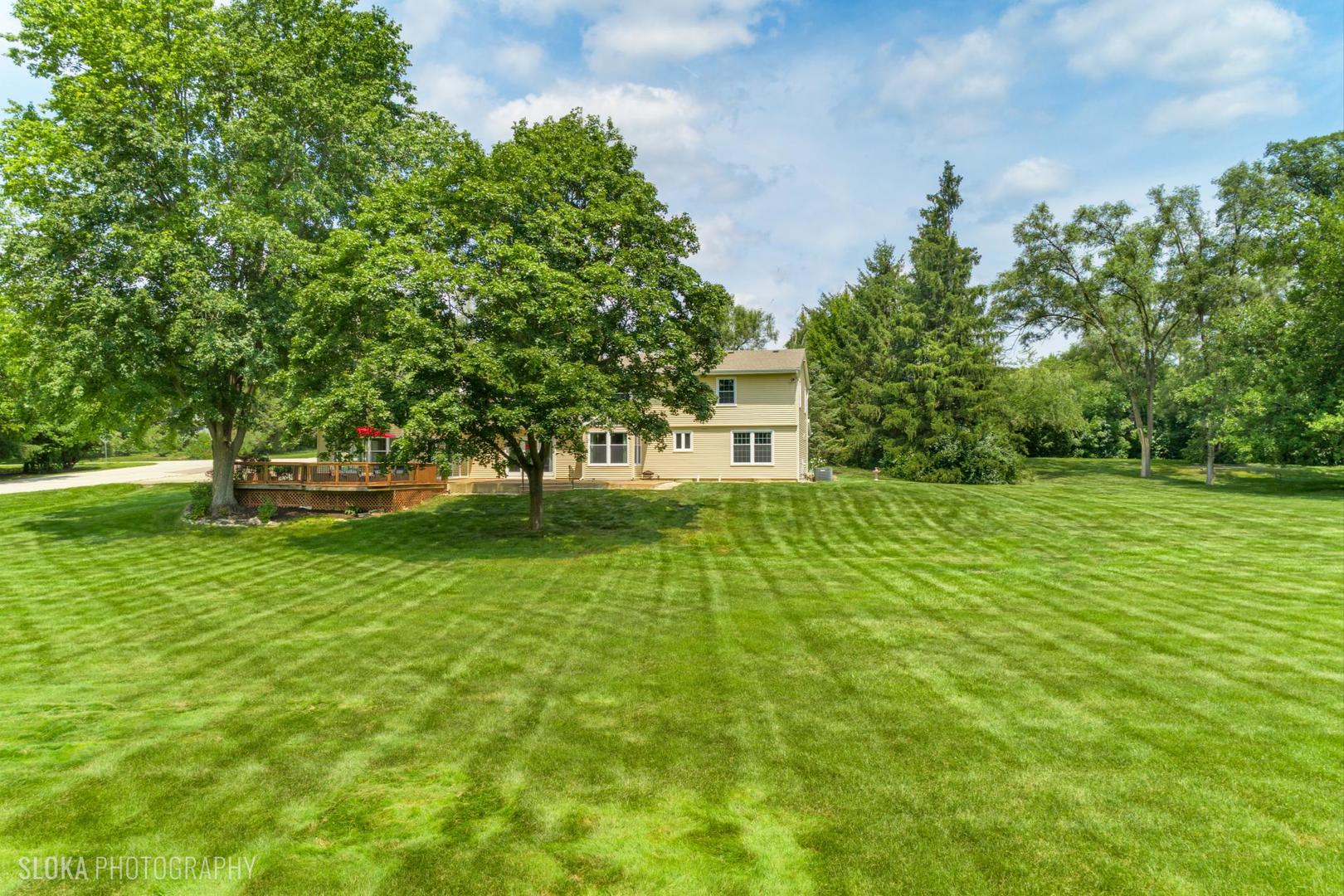 25839 West Sunset Road Barrington, IL 60010 - Photo 47 of 54 a view of a house with a yard