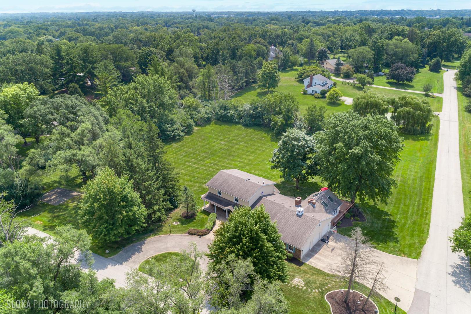 25839 West Sunset Road Barrington, IL 60010 - Photo 50 of 54 an aerial view of a house with yard and outdoor seating