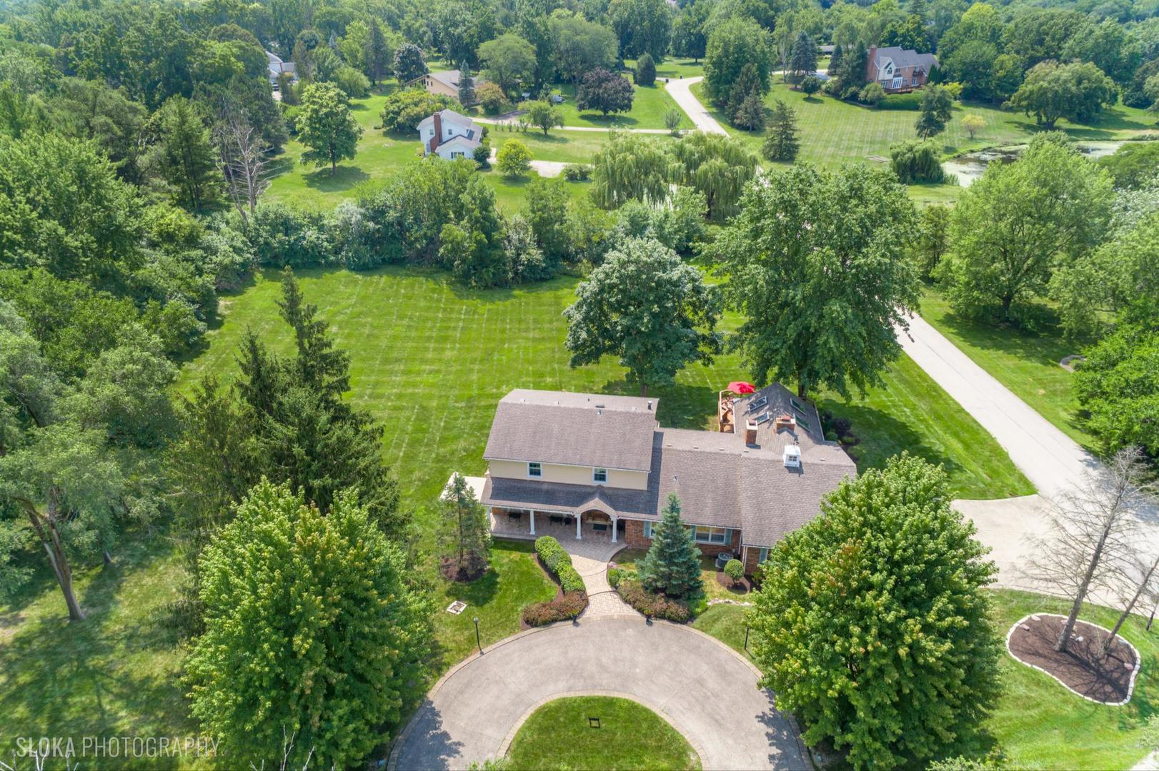 25839 West Sunset Road Barrington, IL 60010 - Photo 5 of 54 an aerial view of a house with outdoor space and lake view
