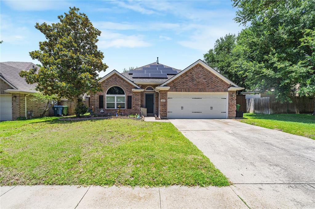 2813 Ridgemere Drive Flower Mound, TX 75028 - Photo 1 of 18 a front view of a house with a garden and trees