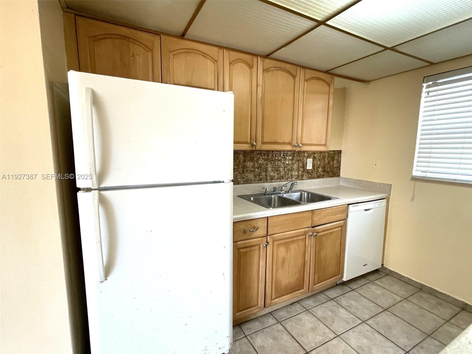 1720 North Congress Avenue, Unit 310 West Palm Beach, FL 33401 - Photo 12 of 18 a utility room with dryer and washer