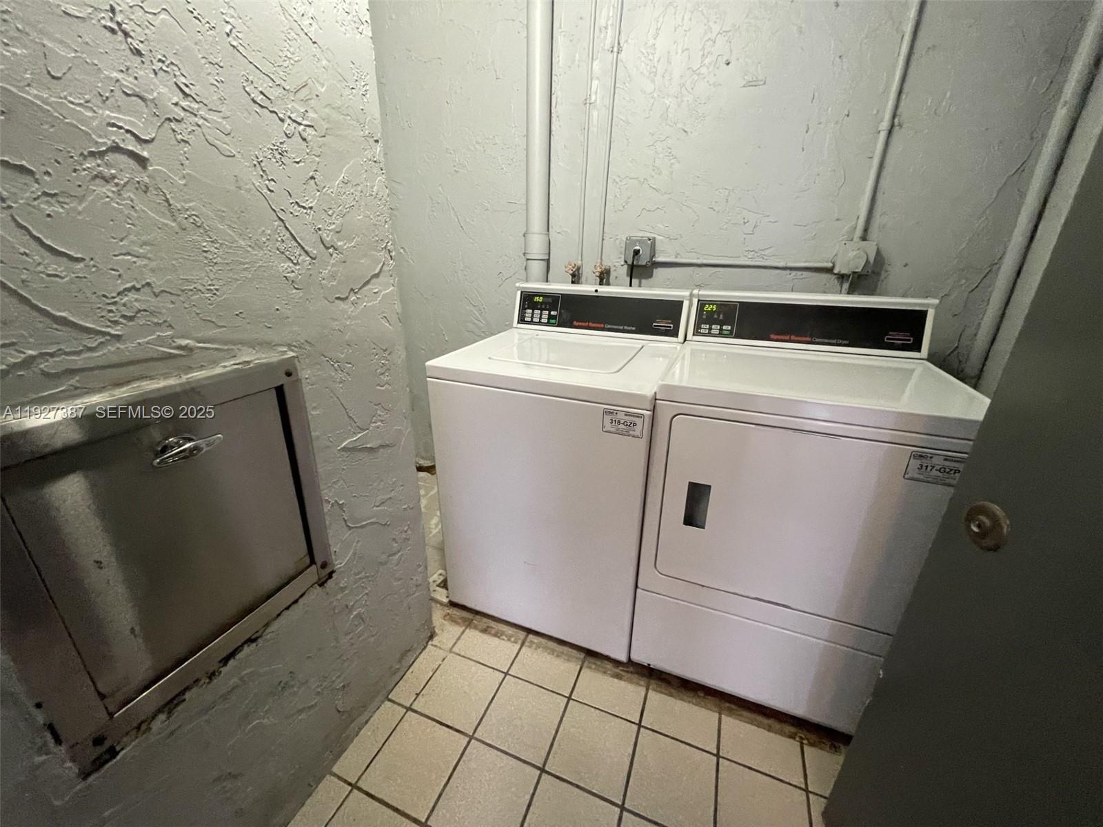 1720 North Congress Avenue, Unit 310 West Palm Beach, FL 33401 - Photo 18 of 18 a utility room with dryer and washer