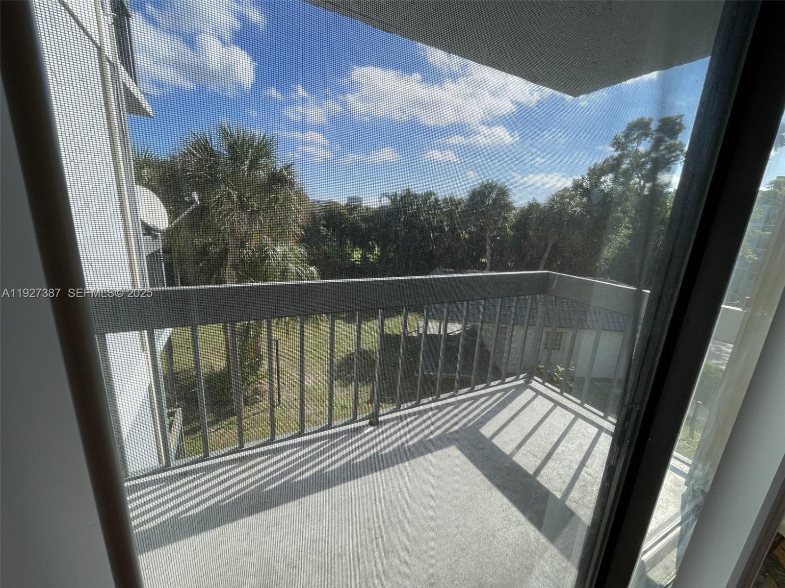 1720 North Congress Avenue, Unit 310 West Palm Beach, FL 33401 - Photo 9 of 18 a view of balcony with furniture