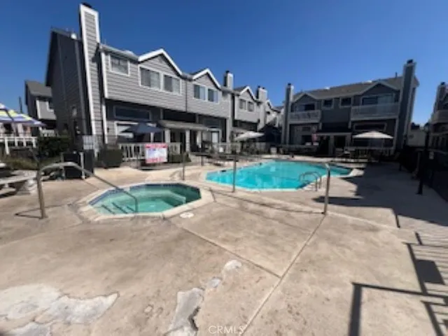 a view of a house with backyard porch and sitting area