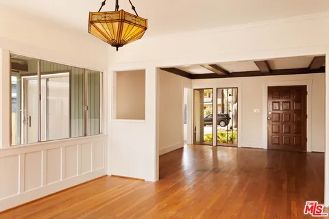 a view of an entryway with wooden floor
