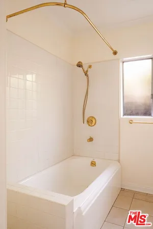 a bathroom with a sink mirror and vanity