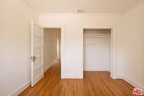 a view of hallway with livingroom