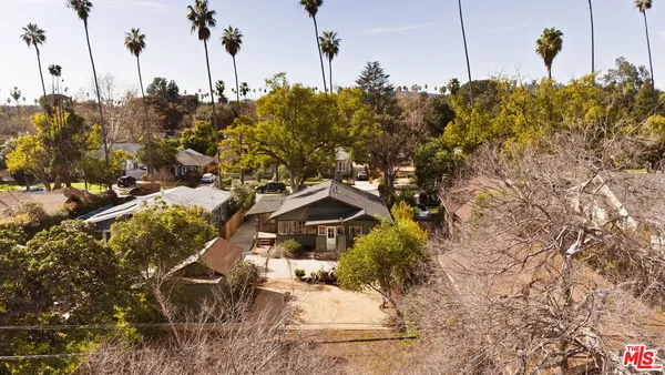 an aerial view of residential house with outdoor space