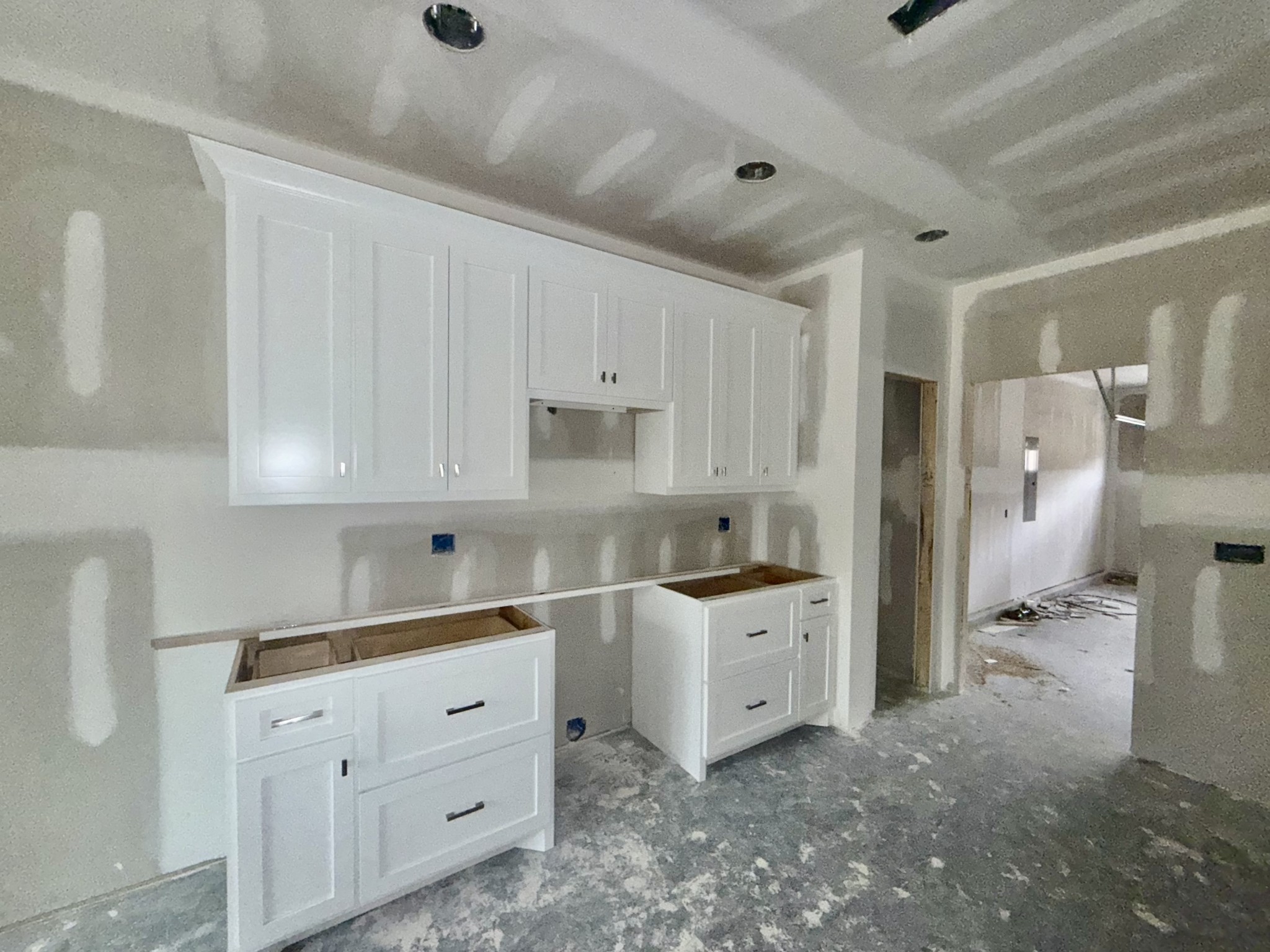 670 North Ballard Road Manchester, TN 37355 - Photo 7 of 22 a kitchen with white cabinets and white appliances