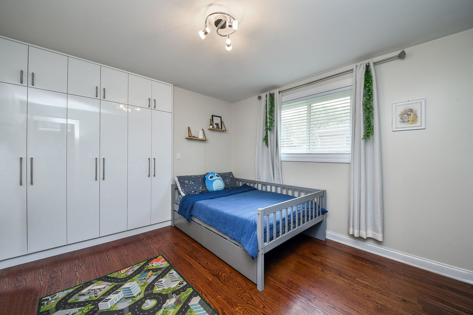 744 Neva Avenue Addison, IL 60101 - Photo 14 of 27 a room with a bed and a window