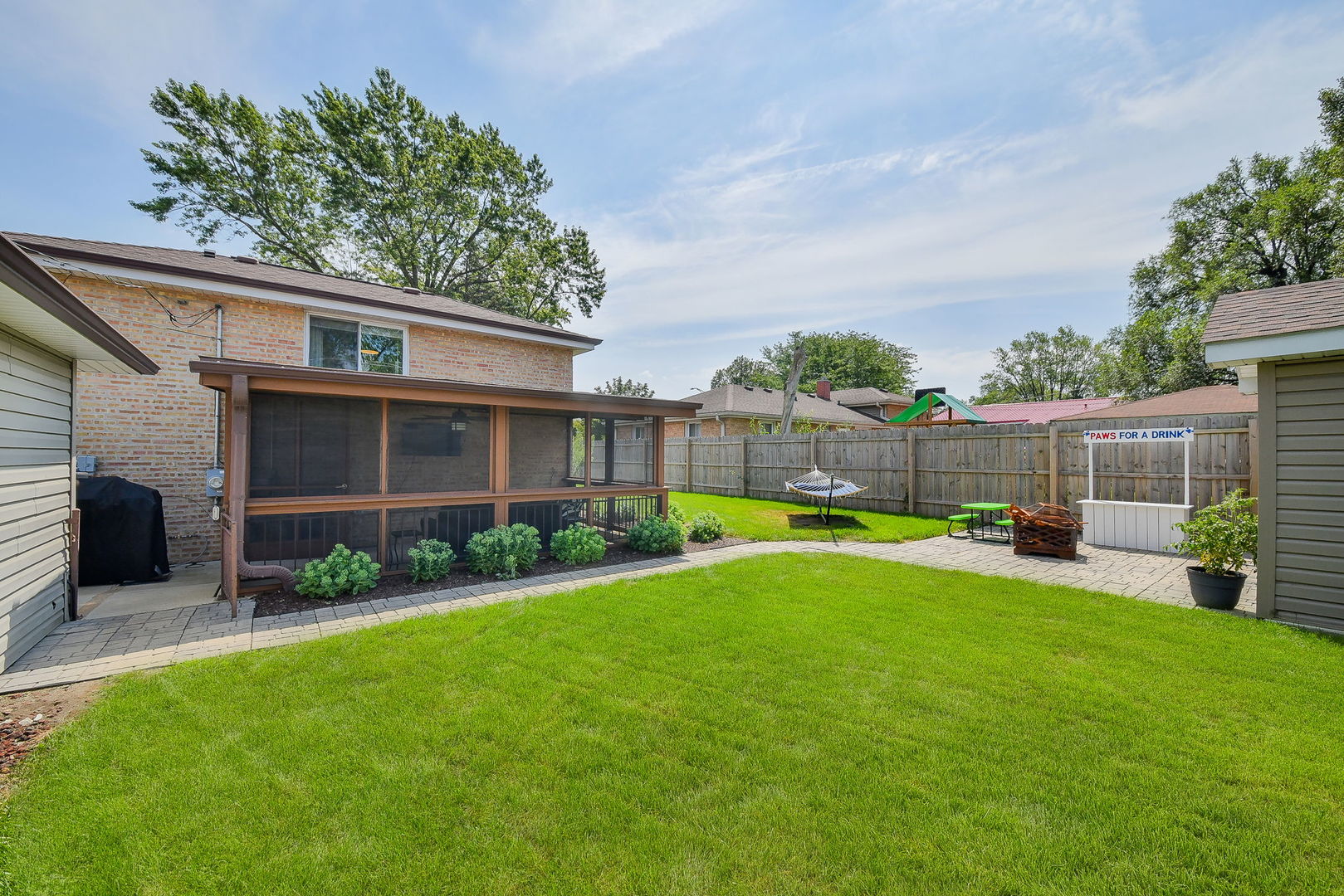 744 Neva Avenue Addison, IL 60101 - Photo 18 of 27 a view of a house with backyard and sitting area
