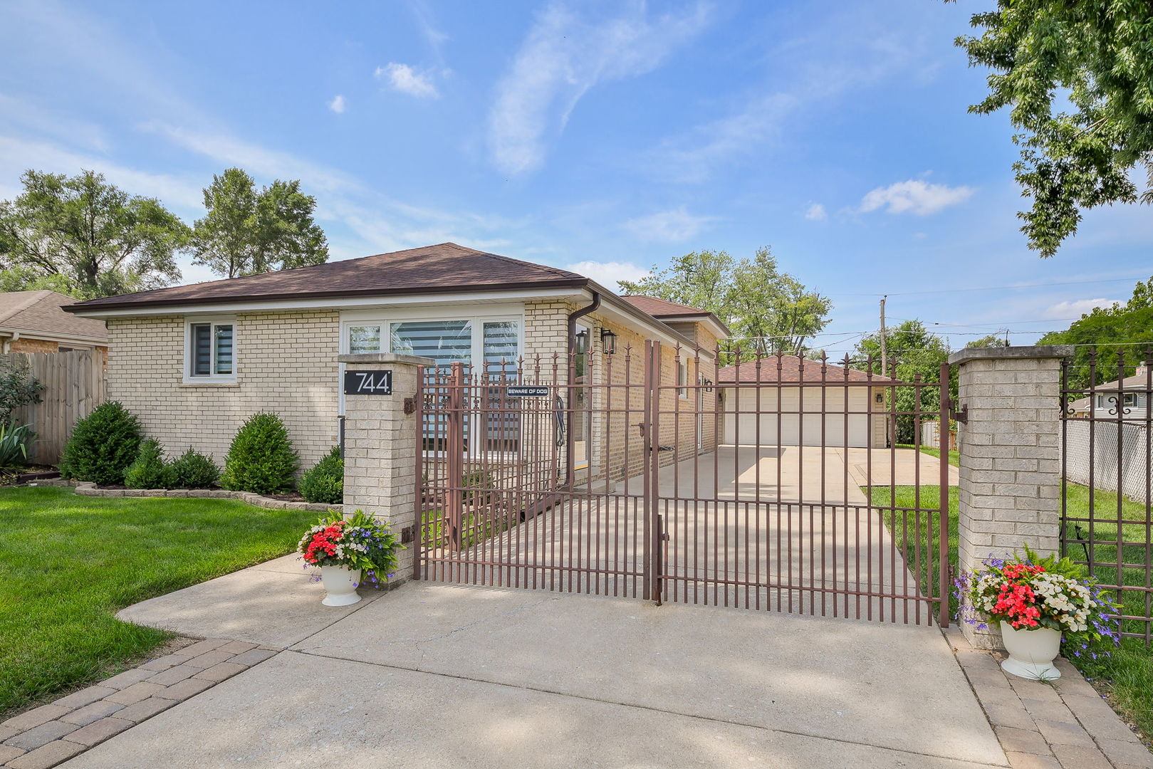 744 Neva Avenue Addison, IL 60101 - Photo 2 of 27 a view of a house with a small yard and plants