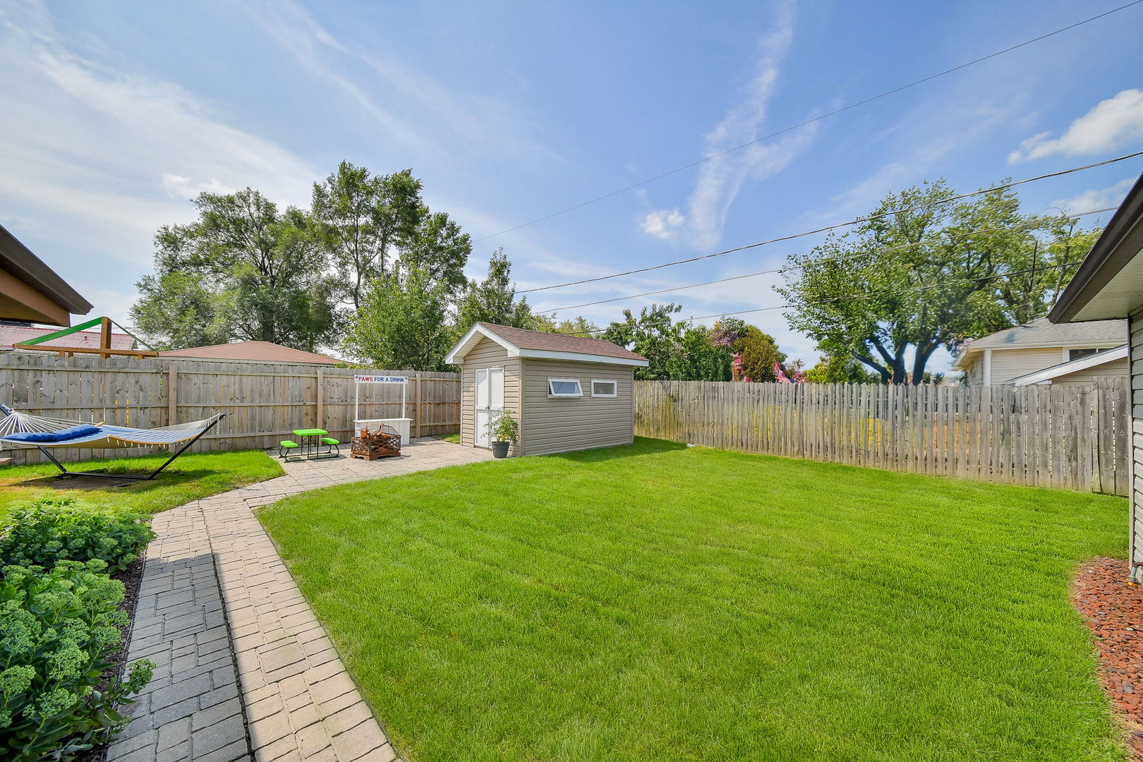 744 Neva Avenue Addison, IL 60101 - Photo 21 of 27 a view of a back yard with green space
