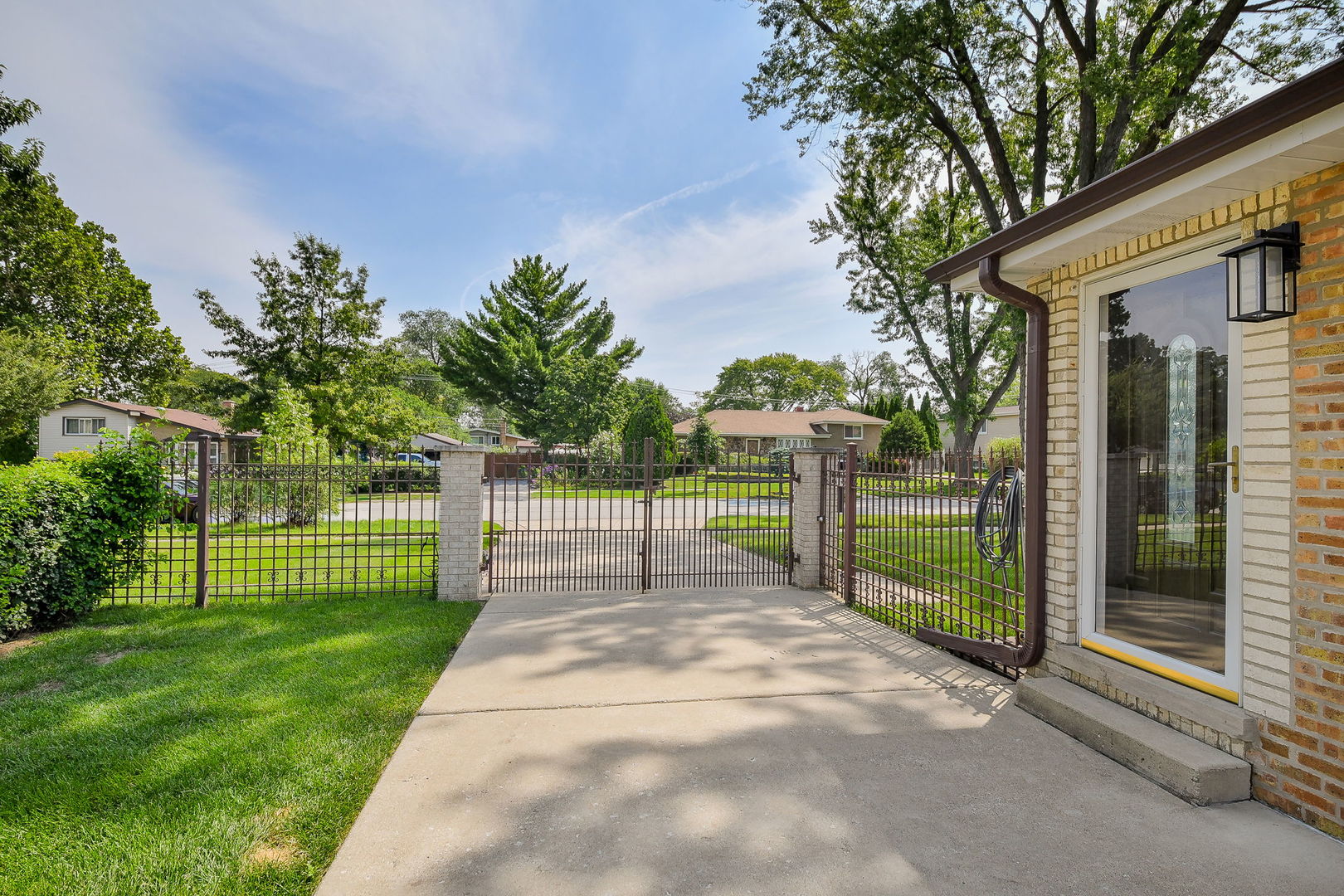 744 Neva Avenue Addison, IL 60101 - Photo 4 of 27 a view of a house with a small yard and plants