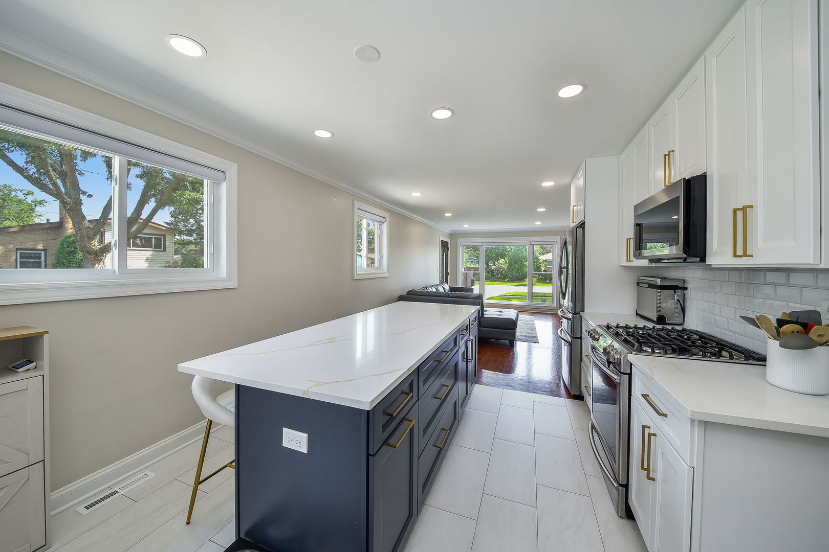 744 Neva Avenue Addison, IL 60101 - Photo 7 of 27 a kitchen with a sink stove and cabinets
