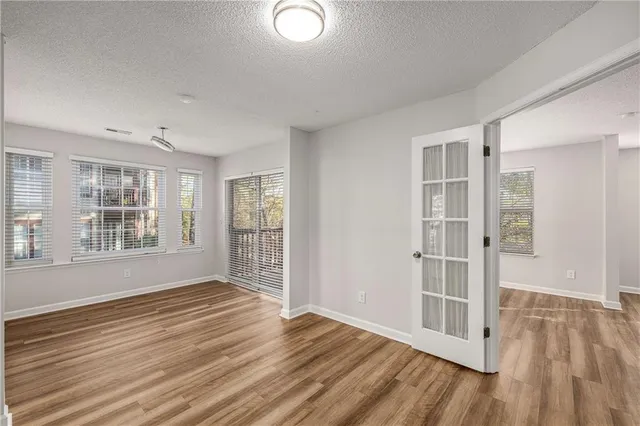 a view of livingroom with hardwood floor and ceiling fan