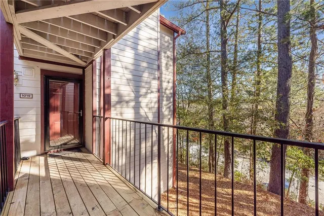 a view of a balcony with wooden floor