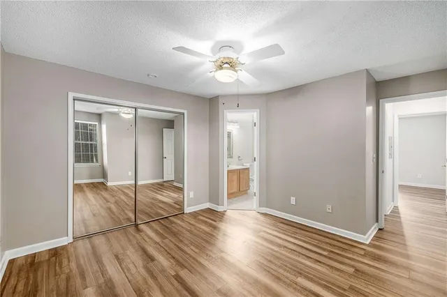 a view of livingroom with hardwood floor and ceiling fan