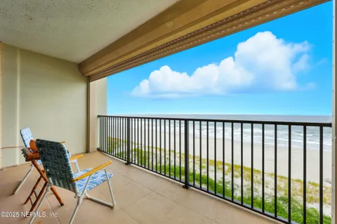 a balcony with chairs