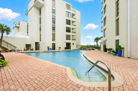 a view of swimming pool with outdoor seating