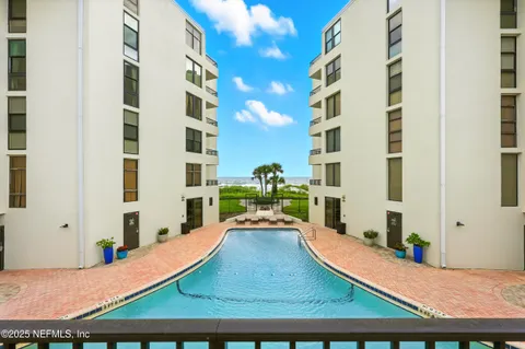 a view of swimming pool with a outdoor seating