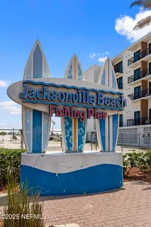 an aerial view of a house with a mountain view