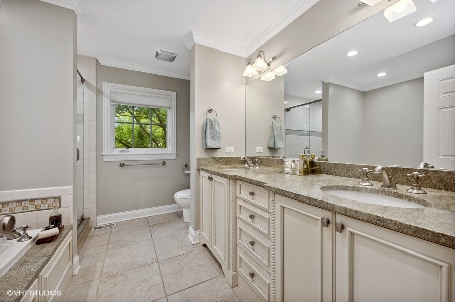 201 Summerfield Road Northbrook, IL 60062 - Photo 30 of 51 a spacious bathroom with a granite countertop sink a mirror and a toilet