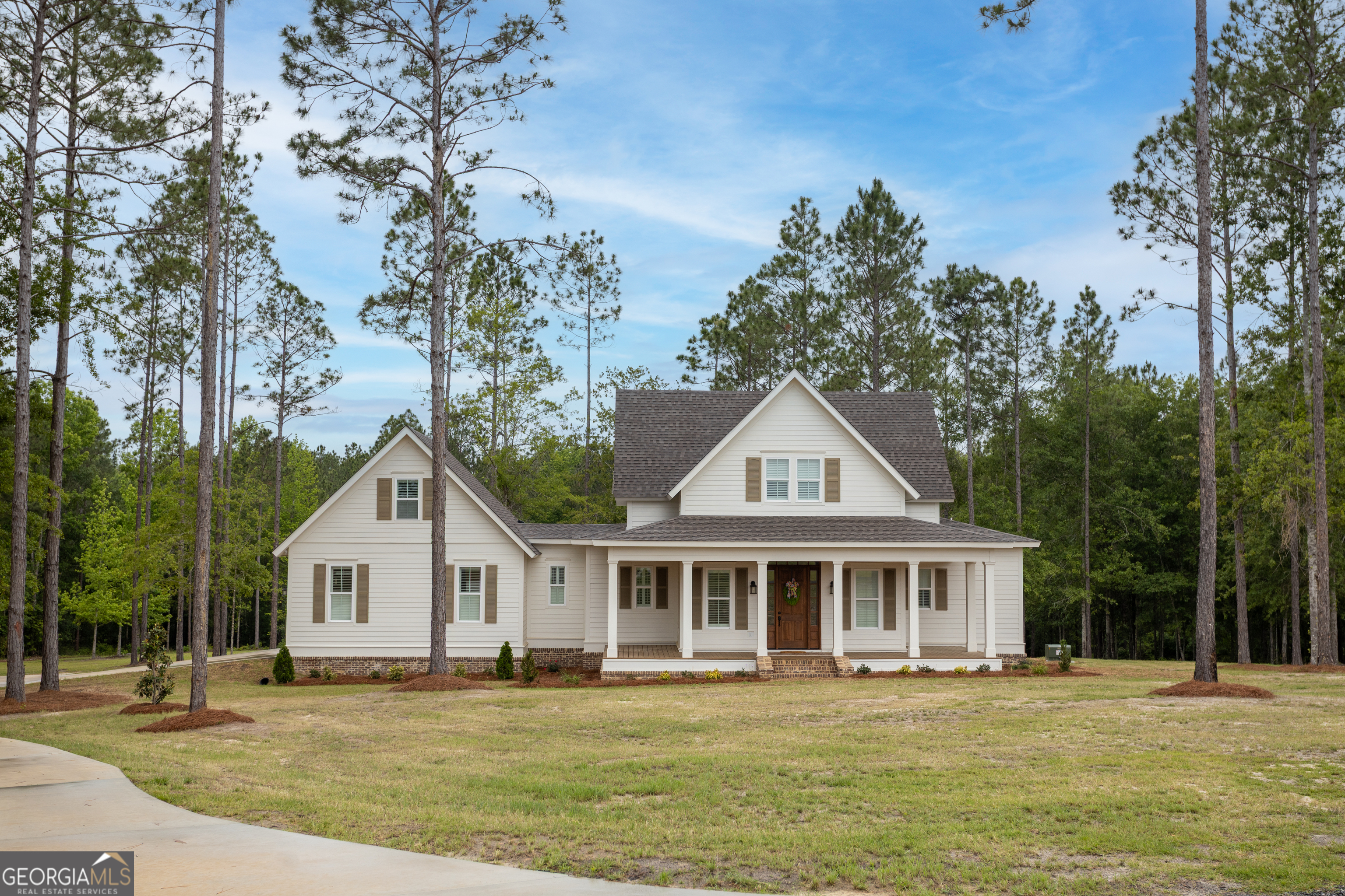 1065 Tarrytown Road Tarrytown, GA 30470 - Photo 1 of 130 a front view of a house with a garden