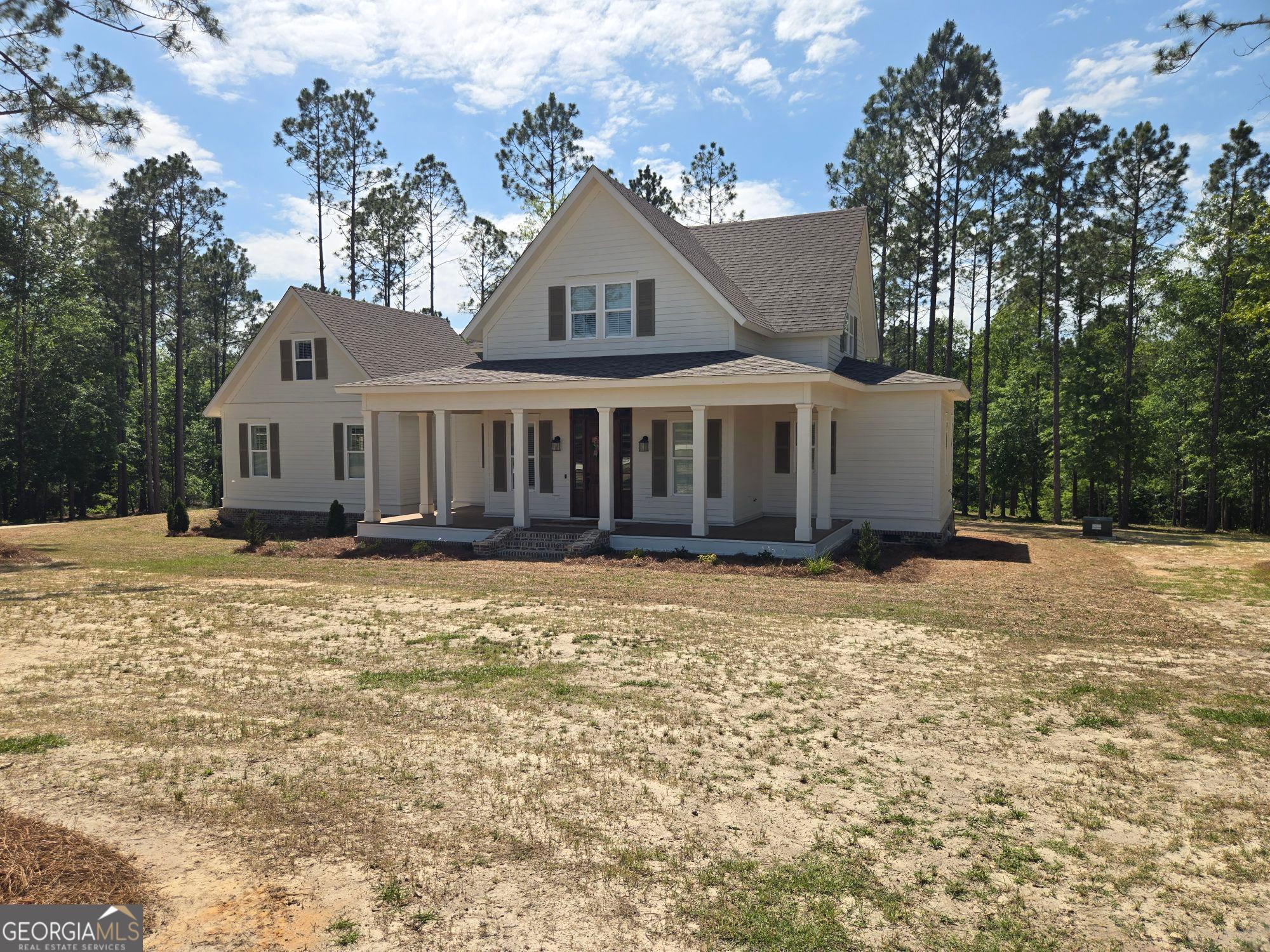 1065 Tarrytown Road Tarrytown, GA 30470 - Photo 2 of 130 a front view of a house with a garden