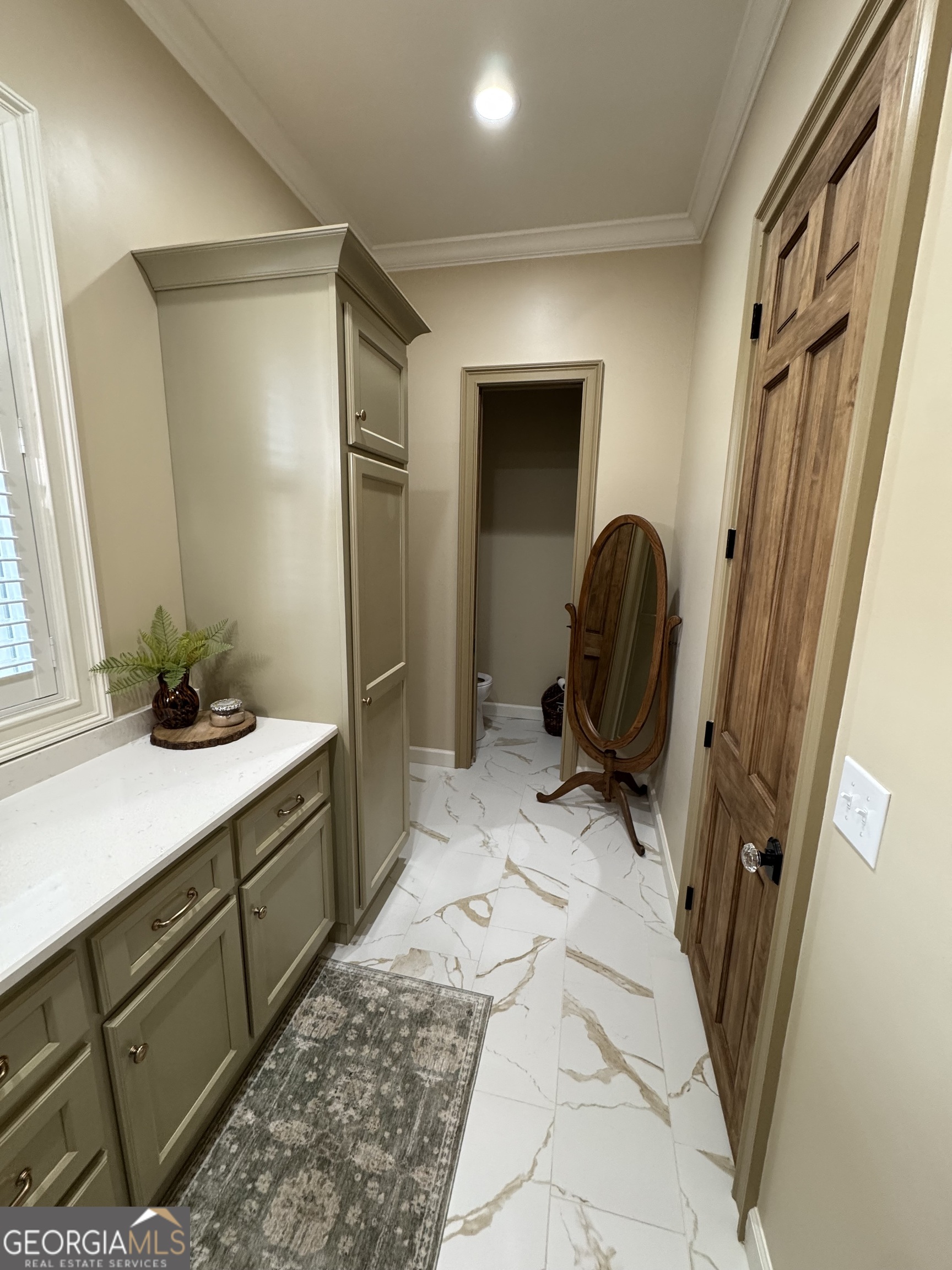 1065 Tarrytown Road Tarrytown, GA 30470 - Photo 42 of 130 a room with a couch and a washing machine with wooden walls