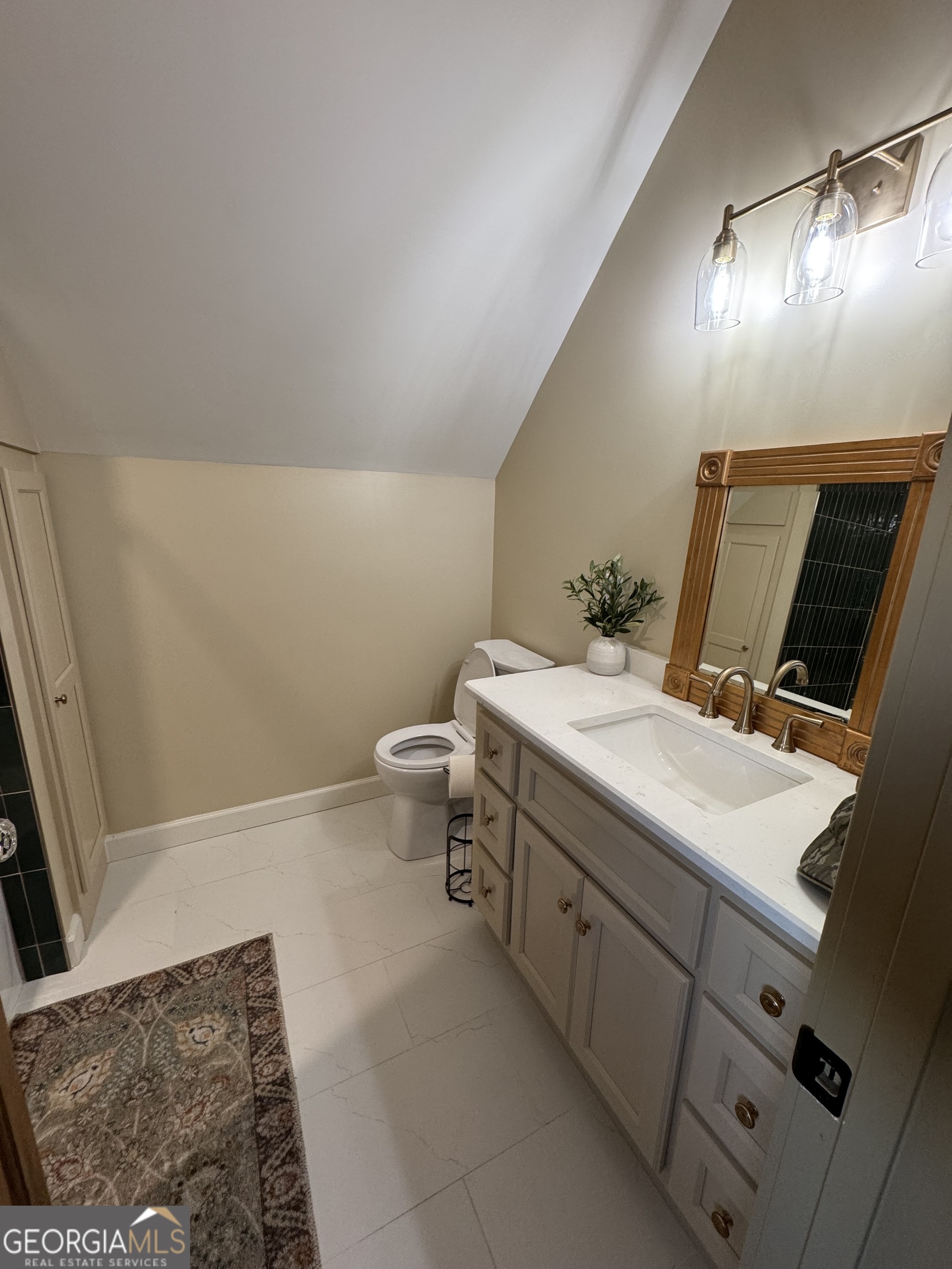 1065 Tarrytown Road Tarrytown, GA 30470 - Photo 53 of 130 a bathroom with a sink and a mirror