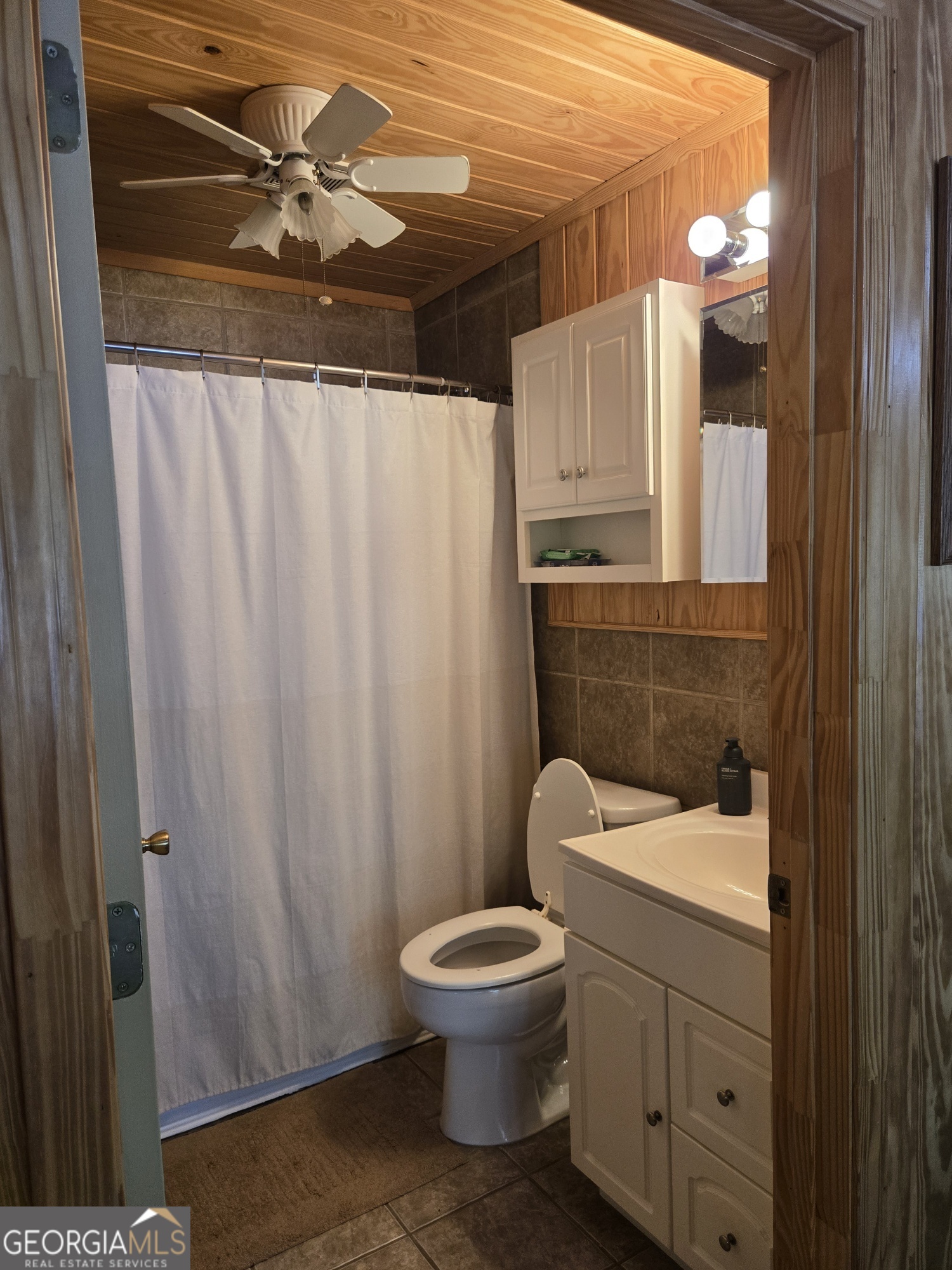 1065 Tarrytown Road Tarrytown, GA 30470 - Photo 82 of 130 a bathroom with a toilet a sink and a mirror