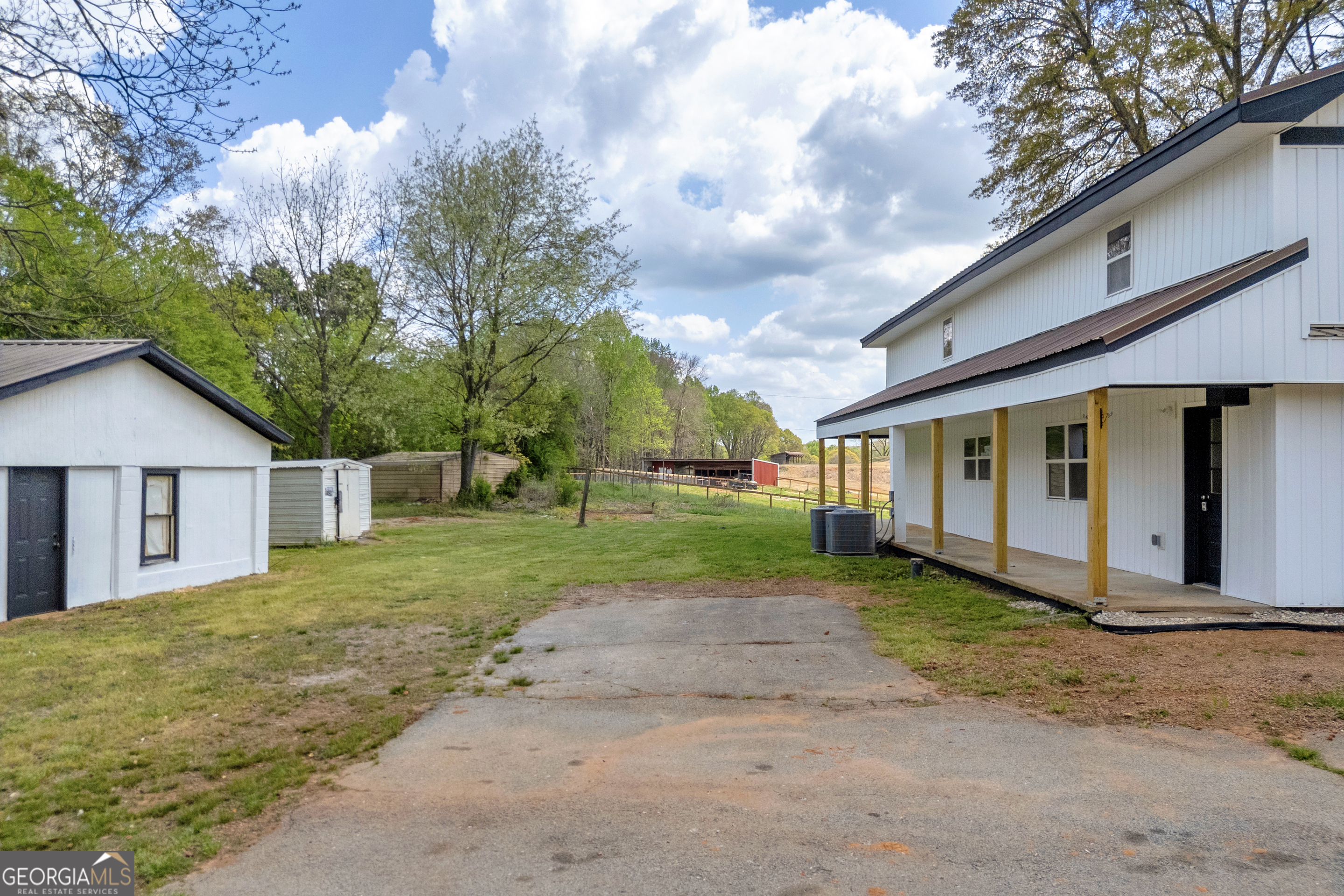 8606 Holly Springs Road Maysville, GA 30558 - Photo 17 of 74 a view of a house with a yard
