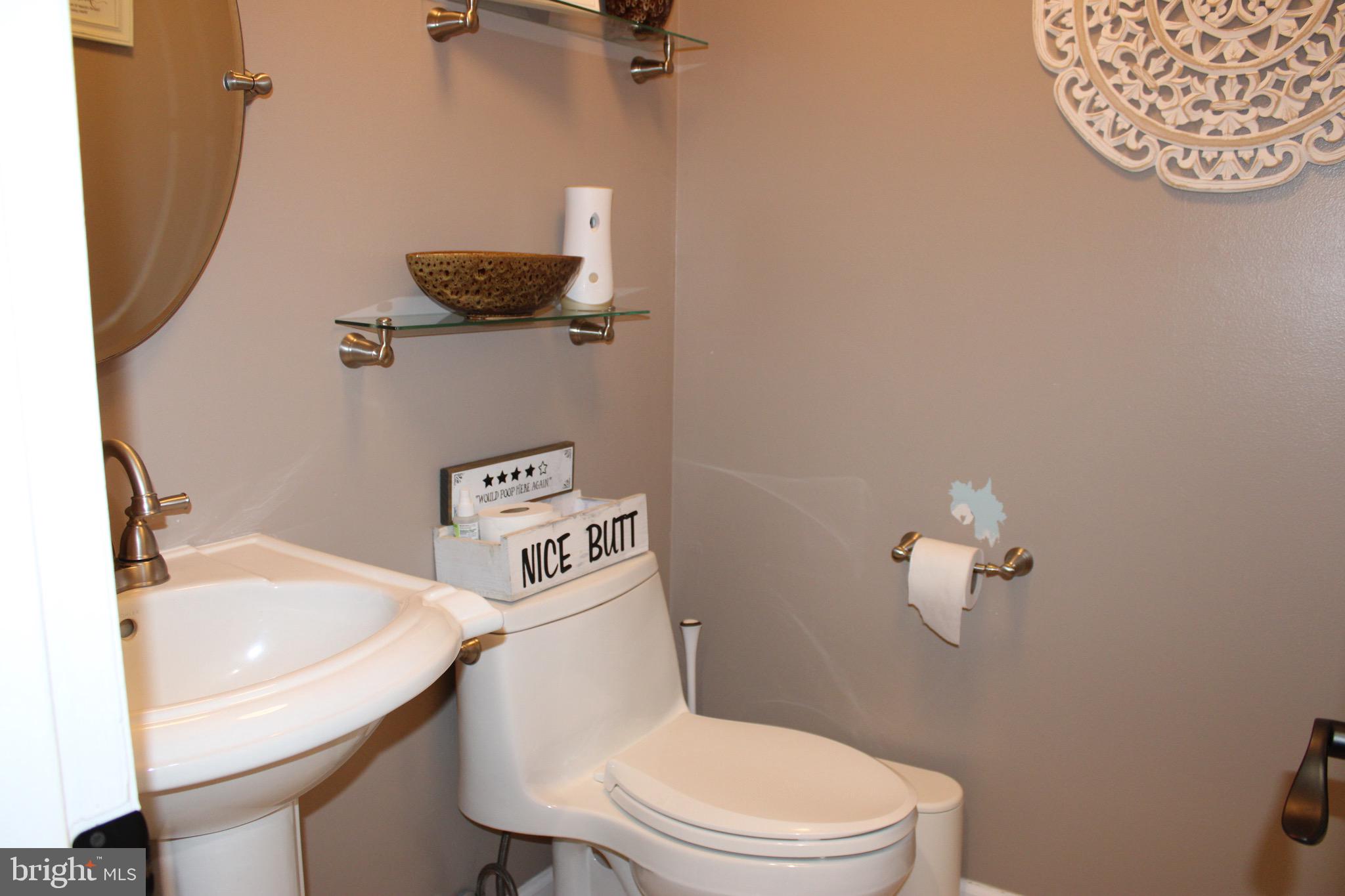 3908 Jackson Road Williamstown, NJ 08094 - Photo 11 of 21 a white toilet sitting next to a bathroom sink