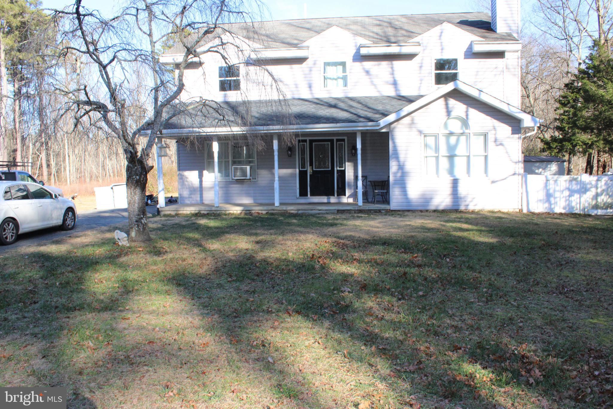 3908 Jackson Road Williamstown, NJ 08094 - Photo 2 of 21 a front view of a building with a garden