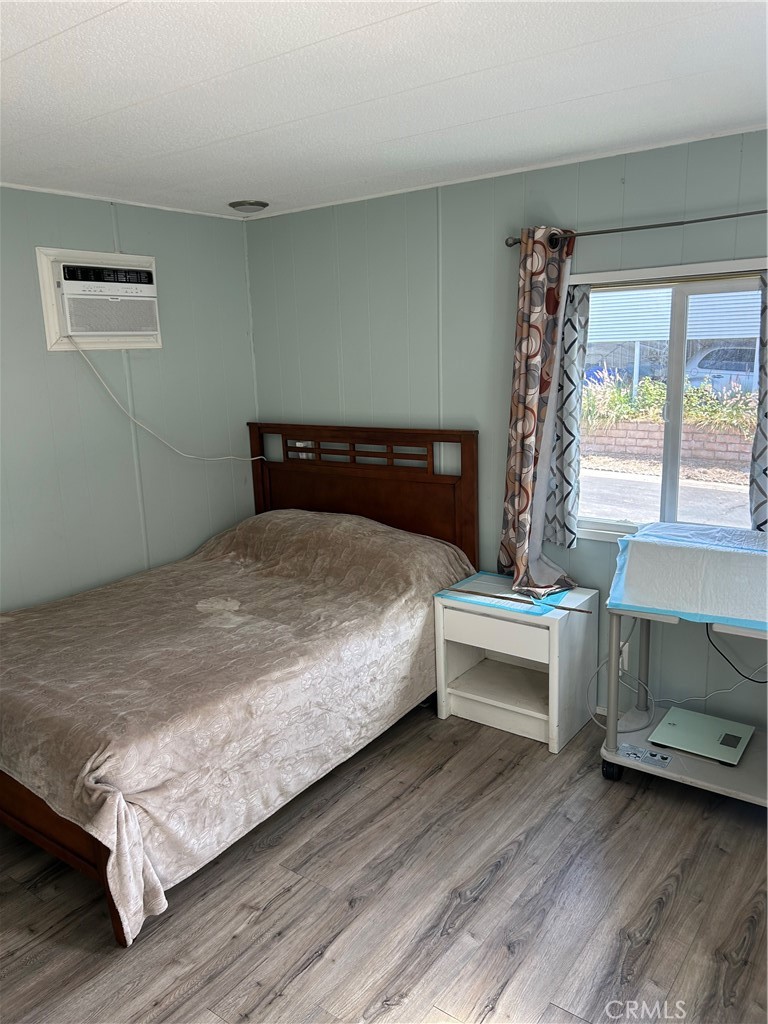 3734 Pacific Street, Unit 40 Highland, CA 92346 - Photo 11 of 35 a bedroom with a bed and a table