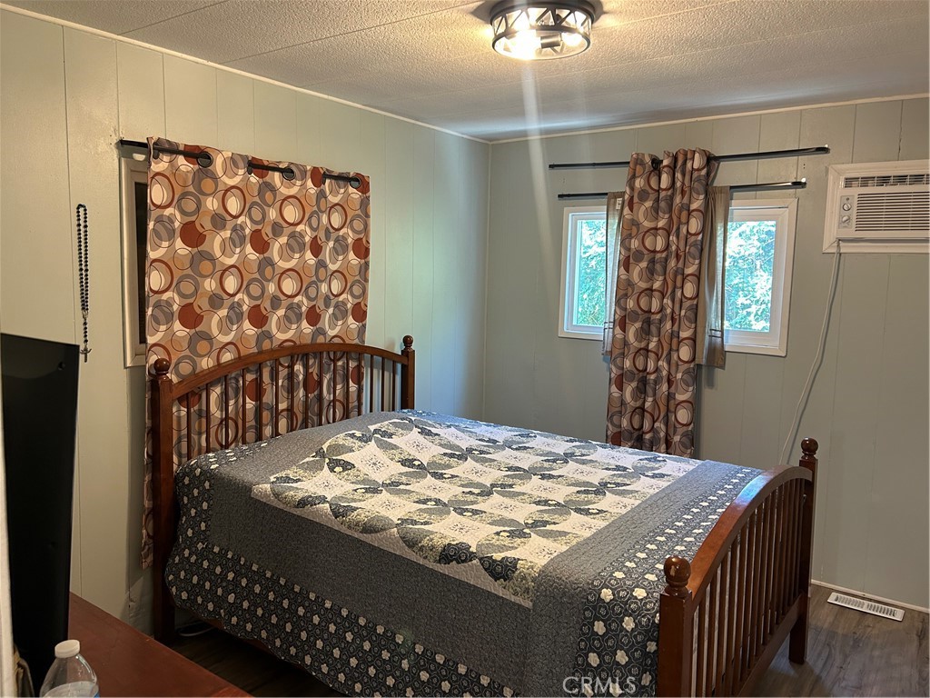 3734 Pacific Street, Unit 40 Highland, CA 92346 - Photo 13 of 35 a bed sitting in a bedroom next to a window