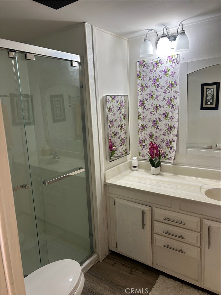 3734 Pacific Street, Unit 40 Highland, CA 92346 - Photo 14 of 35 a bathroom with a sink toilet and shower