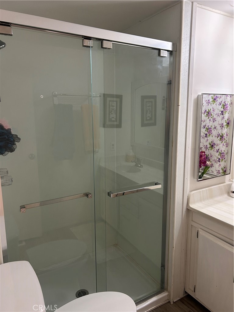 3734 Pacific Street, Unit 40 Highland, CA 92346 - Photo 15 of 35 a bathroom with a shower and toilet