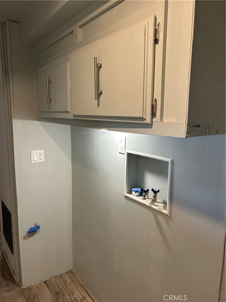 3734 Pacific Street, Unit 40 Highland, CA 92346 - Photo 22 of 35 a view of an entryway with wooden floor