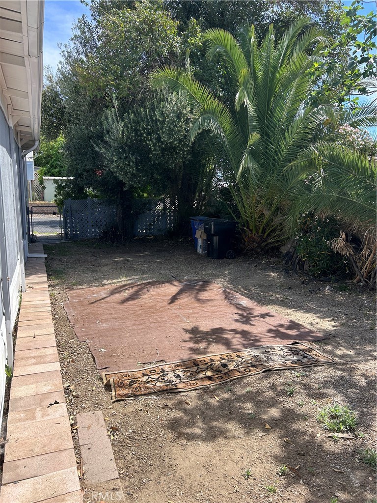 3734 Pacific Street, Unit 40 Highland, CA 92346 - Photo 26 of 35 a backyard of a house with lots of green space