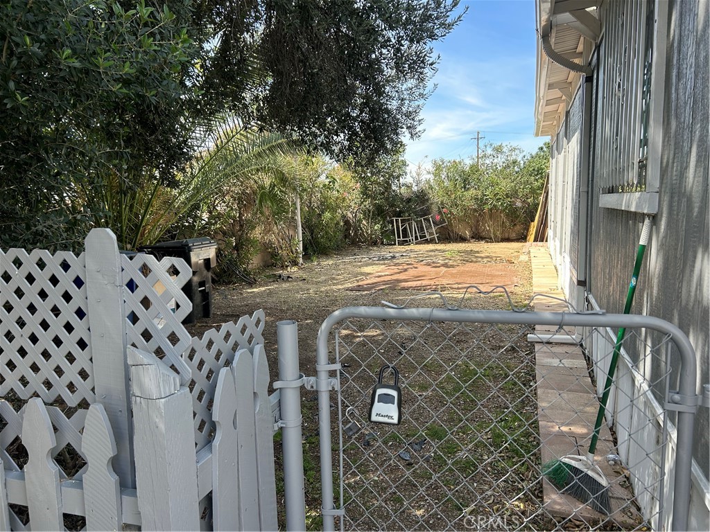 3734 Pacific Street, Unit 40 Highland, CA 92346 - Photo 30 of 35 a view of a backyard with pathway