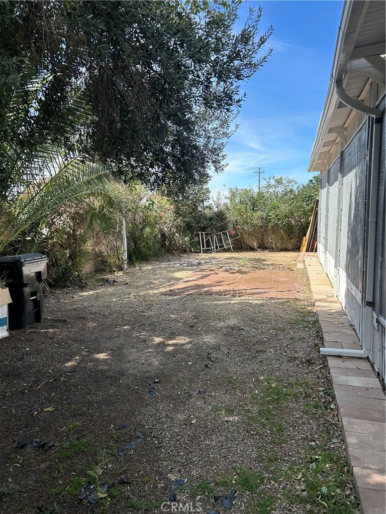 3734 Pacific Street, Unit 40 Highland, CA 92346 - Photo 31 of 35 a view of dirt yard with large trees