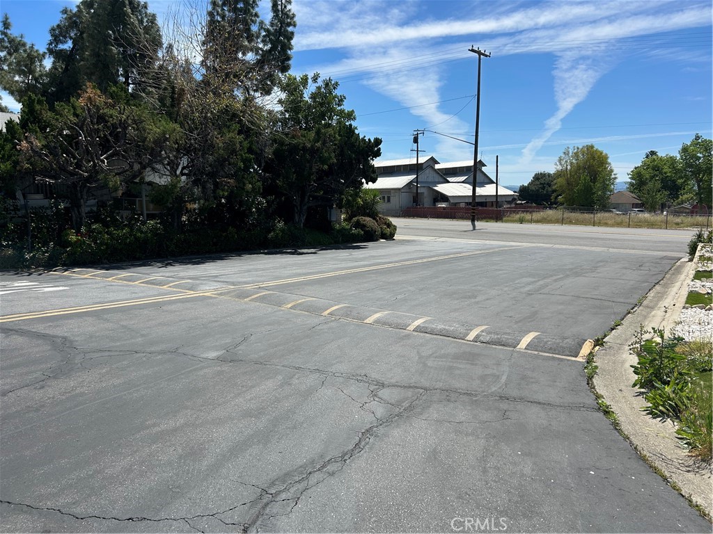 3734 Pacific Street, Unit 40 Highland, CA 92346 - Photo 33 of 35 a view of a road with a bench in the background
