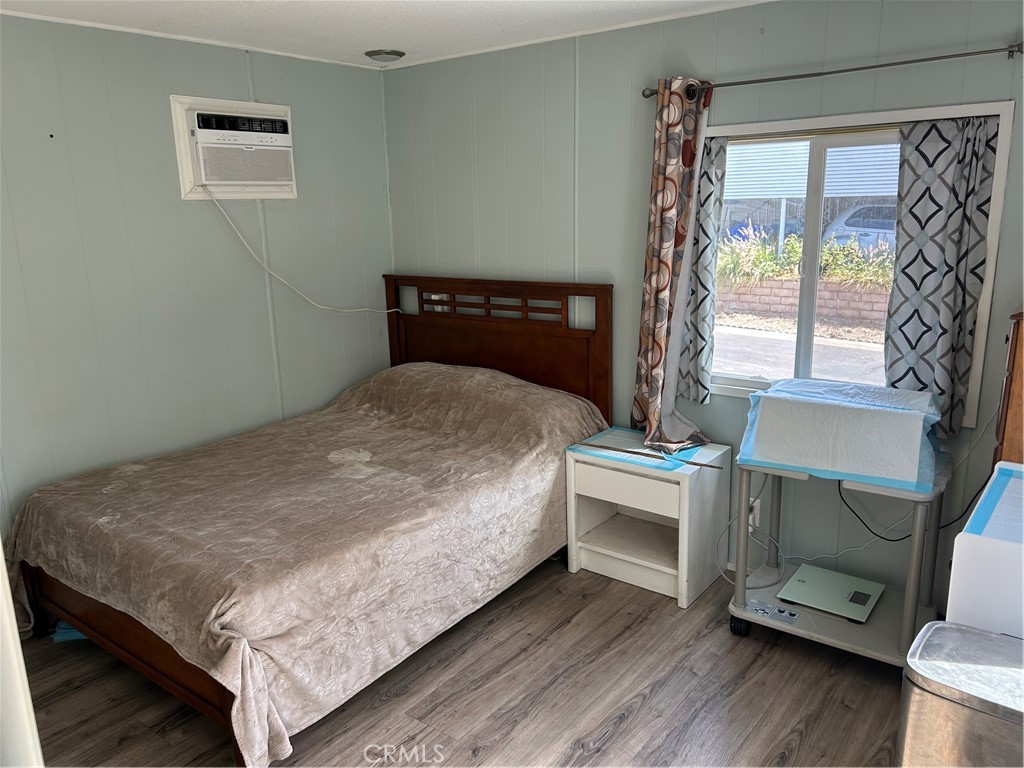 3734 Pacific Street, Unit 40 Highland, CA 92346 - Photo 10 of 35 a bed sitting in a bedroom next to a window