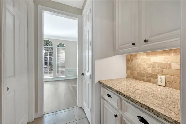 a view of a kitchen from the hallway