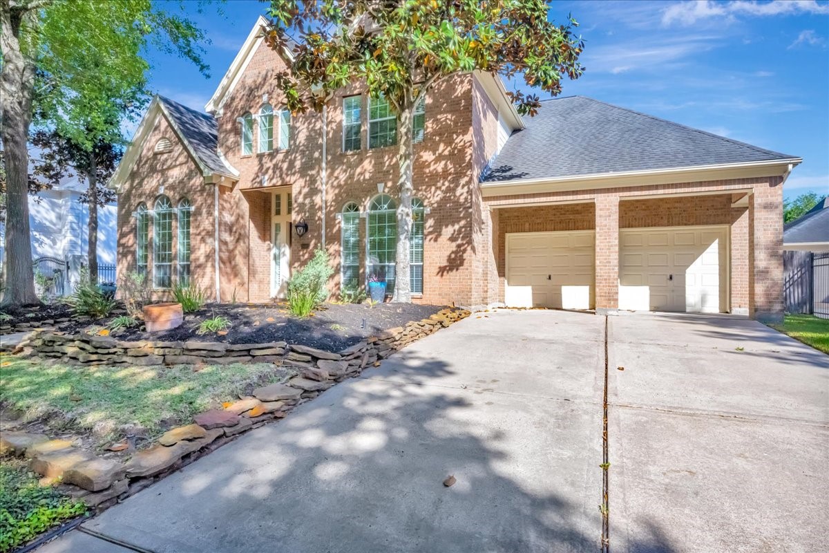 15511 Turtle Oak Court Houston, TX 77059 - Photo 2 of 50 a view of a house with a backyard