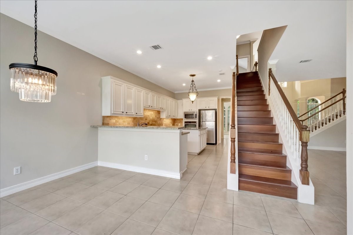 15511 Turtle Oak Court Houston, TX 77059 - Photo 22 of 50 a view of kitchen with furniture and window