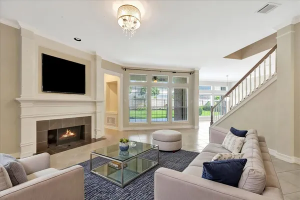 a view of an empty room with a fireplace and a window