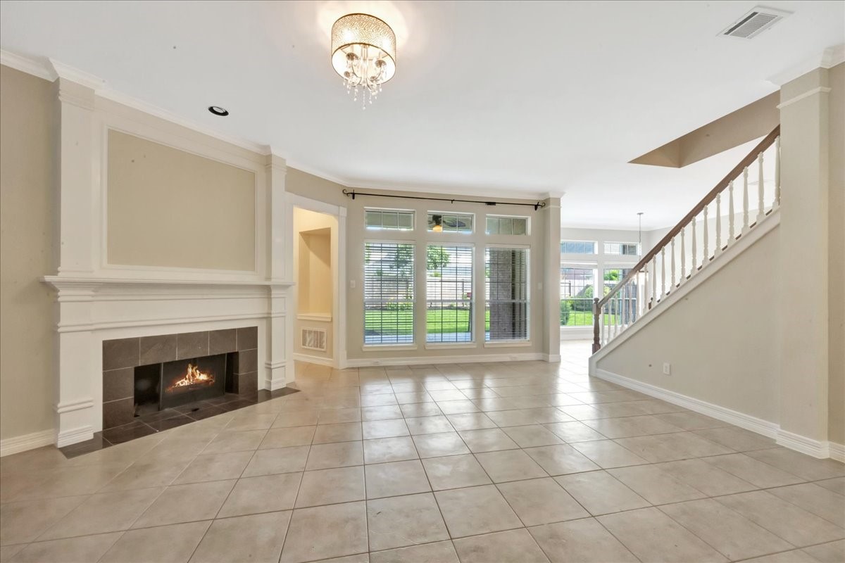 15511 Turtle Oak Court Houston, TX 77059 - Photo 26 of 50 a view of an empty room with a fireplace and a window
